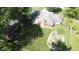 Aerial view of a well-maintained backyard featuring a custom water feature and mature trees at 1231 S Catherwood Ave, Indianapolis, IN 46203