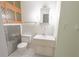 Cozy bathroom featuring a toilet, sink, and cabinet at 1231 S Catherwood Ave, Indianapolis, IN 46203