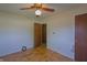 Bedroom with wood floors, ceiling fan, and ample closet space at 1231 S Catherwood Ave, Indianapolis, IN 46203