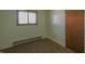 Simple bedroom with natural light and neutral walls at 1231 S Catherwood Ave, Indianapolis, IN 46203