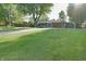 Well-maintained single-Gathering home with a lush green lawn and mature trees providing shade and curb appeal at 1231 S Catherwood Ave, Indianapolis, IN 46203