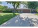 Charming ranch-style home with a long driveway and well-maintained lawn at 1231 S Catherwood Ave, Indianapolis, IN 46203