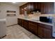 Bright laundry room with lots of cabinet space and modern flooring at 1231 S Catherwood Ave, Indianapolis, IN 46203