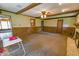 Spacious living room with beam ceilings and a stone fireplace at 1231 S Catherwood Ave, Indianapolis, IN 46203