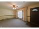 Cozy living room with large window and vintage ceiling fan at 1231 S Catherwood Ave, Indianapolis, IN 46203