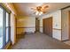 Bright living room featuring a ceiling fan and large window at 1231 S Catherwood Ave, Indianapolis, IN 46203