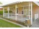 Cozy covered front porch with decorative railing and stone accents at 1231 S Catherwood Ave, Indianapolis, IN 46203