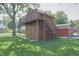 Unique storage shed featuring a second-story deck and convenient staircase at 1231 S Catherwood Ave, Indianapolis, IN 46203