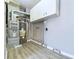 Utility room with furnace, water heater, and storage cabinets at 1235 Indiana Ave, Anderson, IN 46012