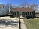 Charming single-Gathering home with a cozy front porch and well-maintained lawn at 1235 Indiana Ave, Anderson, IN 46012