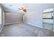 The spacious living room has new gray carpet and gray walls that leads into the kitchen at 1235 Indiana Ave, Anderson, IN 46012