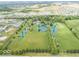 Large acreage including lush grass, mature trees, and picturesque pond views at 12484 E 156Th St, Noblesville, IN 46060