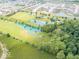 A large lush lawn and multiple picturesque ponds offer serenity and a sense of privacy at 12484 E 156Th St, Noblesville, IN 46060