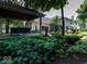 Beautiful backyard with patio, covered seating, and lush greenery, providing a serene outdoor experience at 12484 E 156Th St, Noblesville, IN 46060