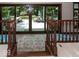 Stairway leading to a balcony overlooking outdoor seating area and lush greenery at 12484 E 156Th St, Noblesville, IN 46060