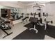 Spacious home gym in basement featuring weight rack, bench, and mirrored wall for complete fitness at 12484 E 156Th St, Noblesville, IN 46060