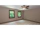 Empty bedroom with hardwood-trimmed windows and neutral carpeting awaiting your personal touch at 12484 E 156Th St, Noblesville, IN 46060