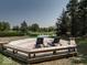 Wooden deck with chairs overlooking a pond at 12484 E 156Th St, Noblesville, IN 46060