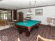 Entertaining game room featuring a pool table and additional seating areas at 12484 E 156Th St, Noblesville, IN 46060
