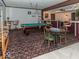 Spacious game room with pool table, bar area, and decorative lighting fixtures at 12484 E 156Th St, Noblesville, IN 46060