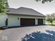 Spacious garage with asphalt driveway in front at 12484 E 156Th St, Noblesville, IN 46060