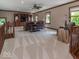 Spacious living room with cozy seating, natural light and a ceiling fan at 12484 E 156Th St, Noblesville, IN 46060