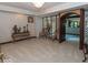 Spacious living room features neutral carpet, elegant decor, and an archway at 12484 E 156Th St, Noblesville, IN 46060