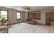 Bright living room with large mirror, comfortable seating, and windows offering scenic views at 12484 E 156Th St, Noblesville, IN 46060