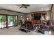 Open living area with comfortable seating and sliding glass doors leading to an outdoor space at 12484 E 156Th St, Noblesville, IN 46060