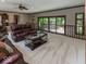 Cozy living room with comfortable seating and access to a balcony area at 12484 E 156Th St, Noblesville, IN 46060