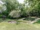 Landscaped pond with a small waterfall feature at 12484 E 156Th St, Noblesville, IN 46060