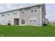 Home backyard with well-maintained lawn and exterior view of the house at 1249 Langham St, Avon, IN 46123