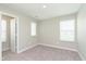 Bright bedroom with plush carpet, neutral walls and natural light from two windows at 1249 Langham St, Avon, IN 46123
