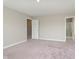 Spacious bedroom with neutral walls, plush carpet, and attached bath at 1249 Langham St, Avon, IN 46123