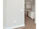 Bright kitchen features white cabinets, stainless steel appliances, and wood-look floors at 1249 Langham St, Avon, IN 46123