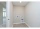 A minimalist laundry room with connections ready for a washer and dryer at 1249 Langham St, Avon, IN 46123