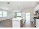 Open concept living area with hardwood floors, recessed lighting, and a sliding glass door at 1249 Langham St, Avon, IN 46123
