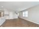 Open concept living room with adjacent kitchen area, light walls and hardwood floors at 1249 Langham St, Avon, IN 46123