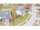 An aerial view shows the home's roof, yard, and surrounding neighborhood at 1501 Willshire Dr, Greenwood, IN 46143