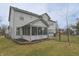 Expansive backyard with a screened-in porch, fence, and well-maintained lawn at 1501 Willshire Dr, Greenwood, IN 46143