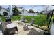 A peaceful patio setting with comfortable seating, a grill, and a lush green lawn at 1501 Willshire Dr, Greenwood, IN 46143