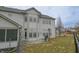 Spacious home backyard featuring a patio, well-maintained lawn, and mature trees at 1501 Willshire Dr, Greenwood, IN 46143
