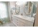 Bathroom featuring a double vanity with marble countertop and elegant decorative mirrors at 1501 Willshire Dr, Greenwood, IN 46143