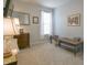 Simple bedroom with light gray walls, a window with sheer curtains, and a chest of drawers at 1501 Willshire Dr, Greenwood, IN 46143