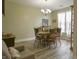 Traditional dining room featuring wood floors, dining table set for eight, and a cozy, inviting atmosphere at 1501 Willshire Dr, Greenwood, IN 46143