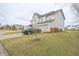 Charming two-story home showcasing a well-manicured front yard and attached garage at 1501 Willshire Dr, Greenwood, IN 46143