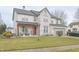 Inviting two-story home featuring a welcoming front porch and classic architectural design at 1501 Willshire Dr, Greenwood, IN 46143