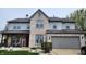 Attractive home with a gray and brick exterior, two stories, and a well-maintained lawn and landscaping at 1501 Willshire Dr, Greenwood, IN 46143