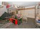 Organized garage space with various tools, lawn equipment, and storage solutions at 1501 Willshire Dr, Greenwood, IN 46143