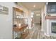 Hallway with hardwood floors that has a console table with decorations and entry to living space at 1501 Willshire Dr, Greenwood, IN 46143